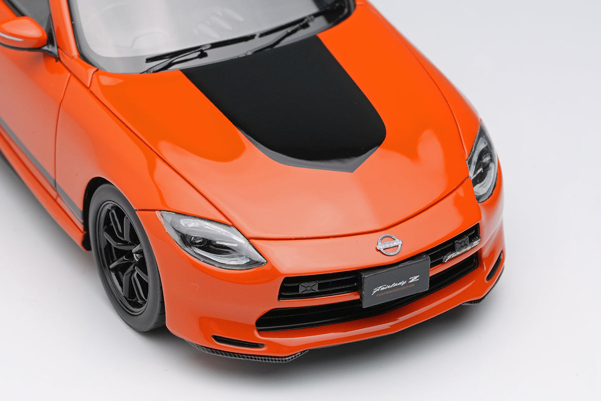 [ Back-order ] Make Up EIDOLON EM735A 1:43 Nissan Fairlady Z Customized Edition 2024 432 Orange model car