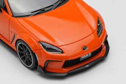 [ Back-order ] Make Up EIDOLON EM725A 1:43 TOM'S GR86 Widebody 2022 Orange model car