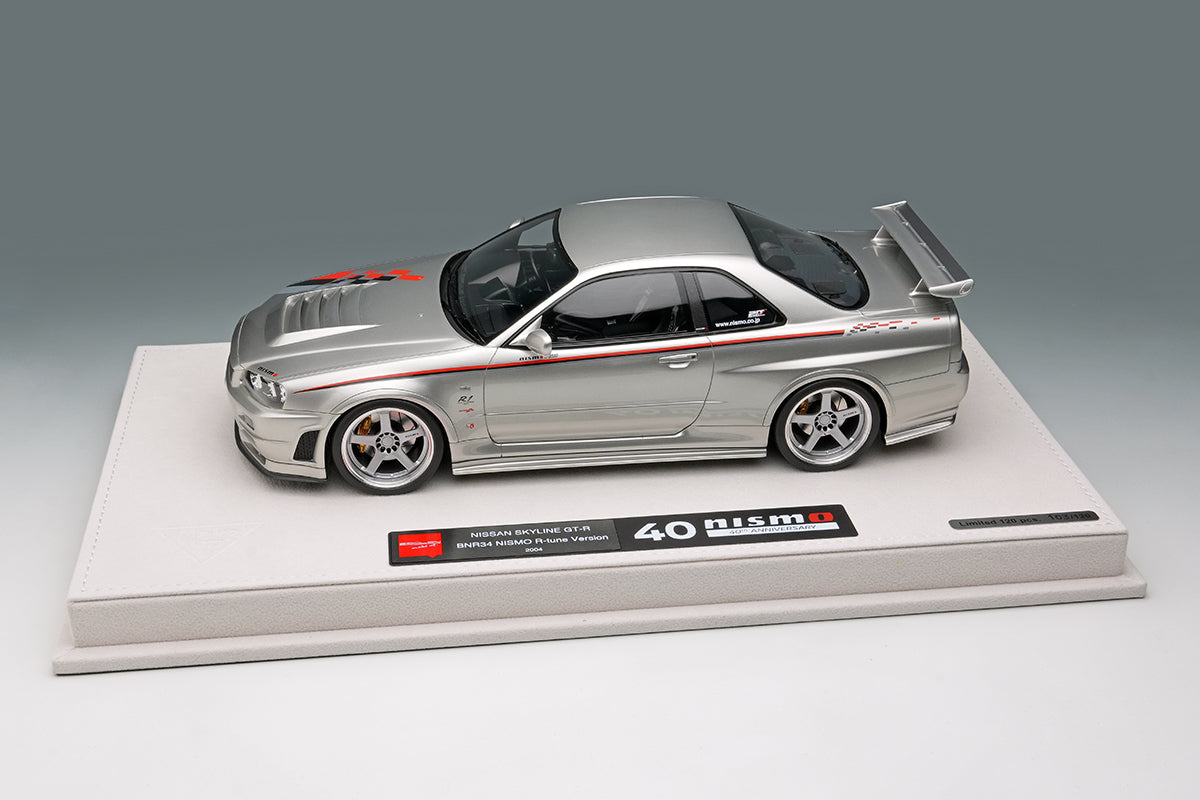 EML135A Make Up EIDOLON 1:18 Nissan Skyline GT-R BNR34 NISMO R-tune Ver 2004 Silver Nismo Stripes