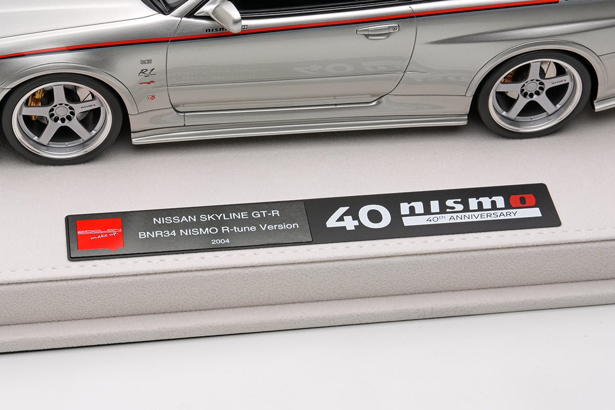 EML135A Make Up EIDOLON 1:18 Nissan Skyline GT-R BNR34 NISMO R-tune Ver 2004 Silver Nismo Stripes