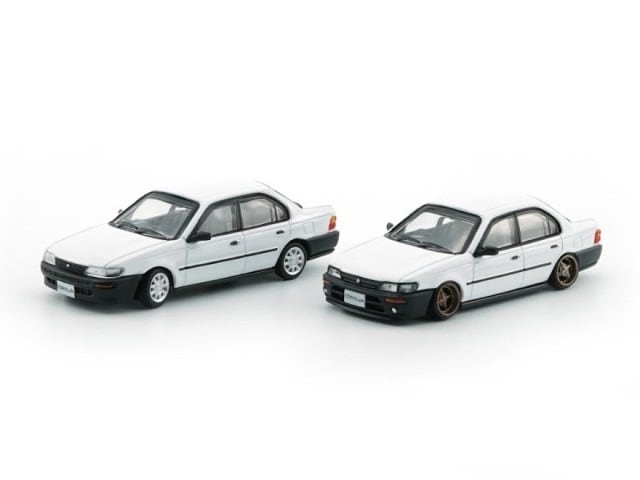 64B0363 BM Creations 1:64 Toyota Corolla AE100 1996 White/Black Bumper (RHD)