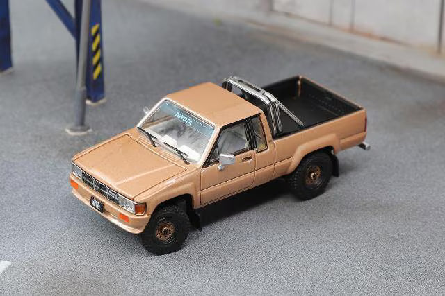 KS-062-516 GCD GainCorp Products 1:64 Toyota Hilux 1985 SR5 Gold (LHD)