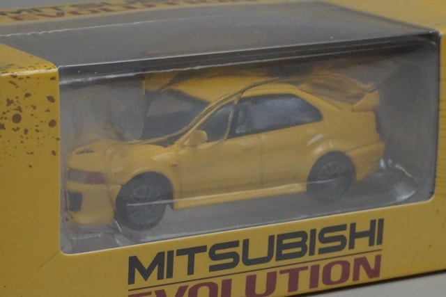 64B0407 BM CREATIONS 1:64 Mitsubishi Lancer Evolution V/VI Yellow RHD model car