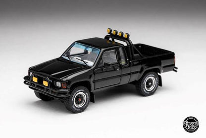 DTG0014-BLK GCD Gaincorp Products 1:64 Toyota 1985 Hilux 4x4 SR5 Extra Cab Black Diecasttalk & BoostGear