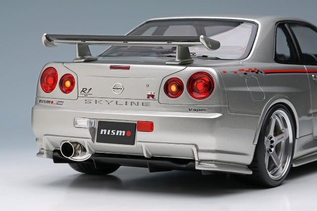 EML135A Make Up EIDOLON 1:18 Nissan Skyline GT-R BNR34 NISMO R-tune Ver 2004 Silver Nismo Stripes
