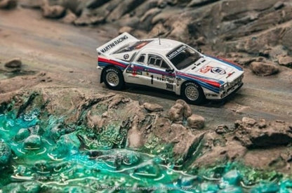 T64P-TL002-83RMC01 Tarmac Works 1:64 Lancia 037 Rally Monte Carlo 1983 Winner W. Rohrl / C. Geistdorfer model car