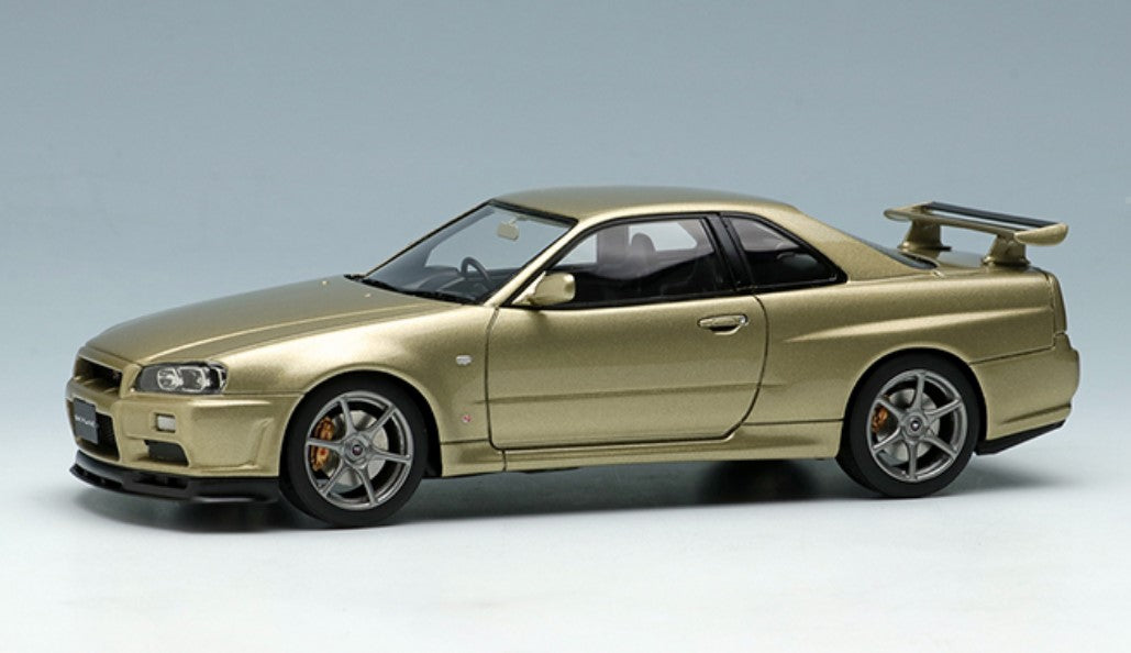 EM373A MakeUp EIDOLON 1:43 Nissan Skyline GT-R BNR34 Mspec Nur 2002 Silica Bless